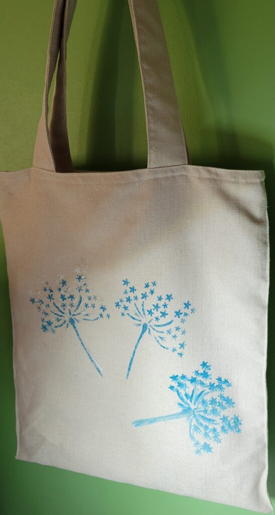 Peinture sur support- Poinsettia sur sac Peinture sur support-Poinsettia au pochoir